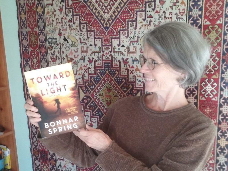 Bonnar holding copy of Toward the Light