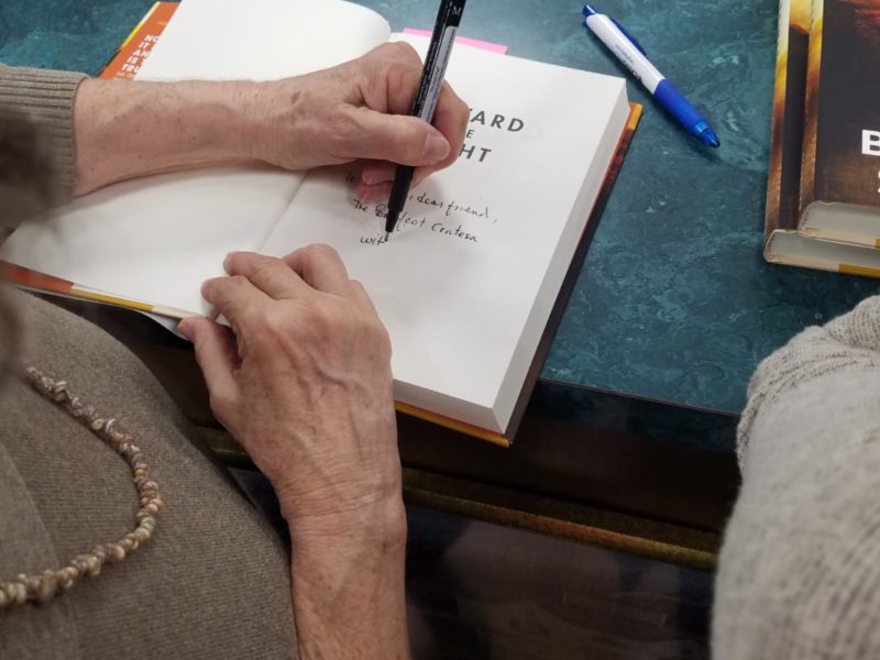 a book being signed by the author